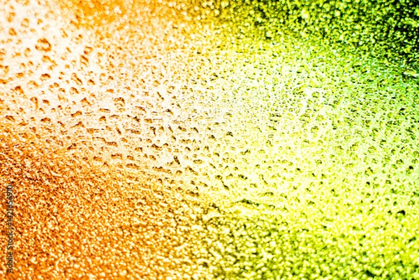 Fototapeta background texture for background bright orange, yellow, sunny, peach and green grass color with shimmer elements and flowing drops on glass, beautiful bright background with iridescent and gradient
