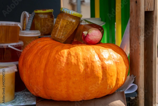 Obraz Pumpkin and jars of pumpkin jam at farmers market