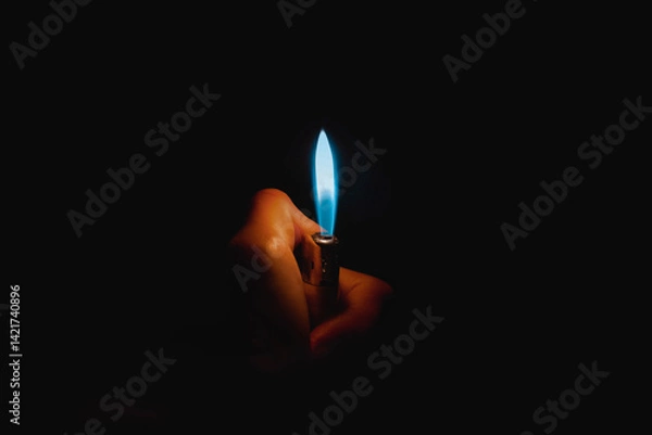 Fototapeta a shot on a fantastic flame in the darkness