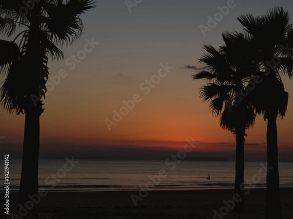 Obraz 夕焼け空の中のサーファー