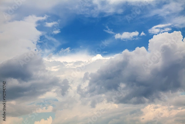 Obraz Beautiful Cumulus Clouds with Sunlight Reflections