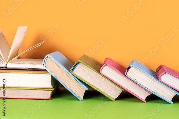 Fototapeta Top view of bright colorful hardback books in a circle.
