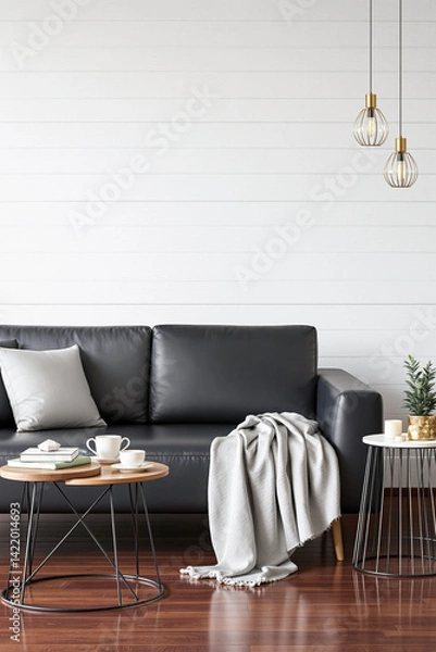 Obraz modern living room with black leather sofa and gray throw