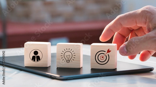 Fototapeta Action plan, objective and target, success and business target concept, project management, and company strategy development stacked wood blocks step on table with icon