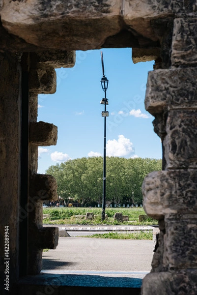 Obraz view through a gate in the wall