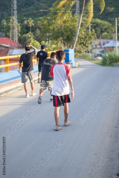 Fototapeta Group of Boys Walking on a Road