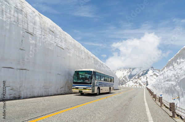 Fototapeta Blur windshield bus move along snow wall at japan alps tateyama kurobe alpine route