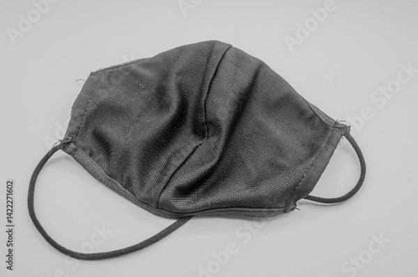 Fototapeta Protective Mask: A close-up shot of a cloth face mask, designed for protection and safety, symbolizing the need for personal health and public well-being.