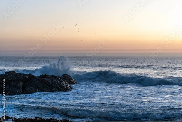 Fototapeta Waves crashing against the rocks on the shore of the Atlantic Ocean