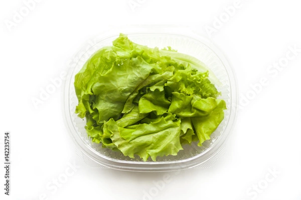 Fototapeta salad in plastic container isolated on white background