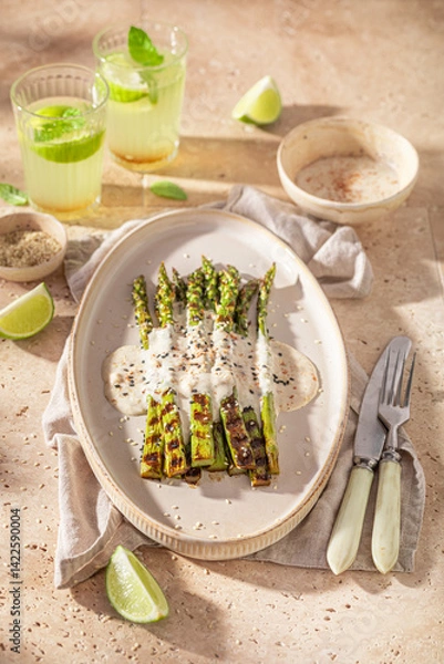 Obraz Fresh grilled asparagus with sesame and lime.