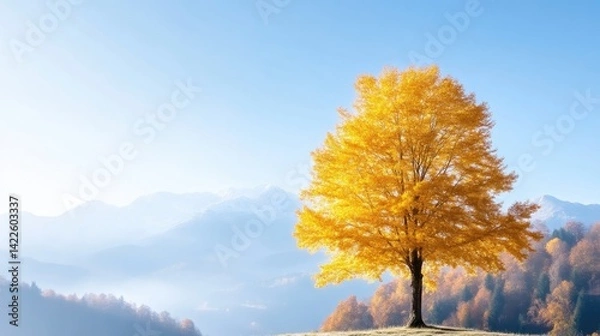 Obraz Golden autumn tree amidst misty mountains