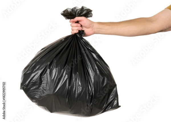 Fototapeta A human hand holding a full black plastic garbage bag by the knot, bulging with contents, representing waste disposal or cleanliness themes, isolated on transparent background.