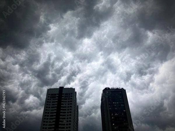 Fototapeta Urban Storm Apocalypse: Menacing Thunderclouds Looming Over City Skyscrapers in Hanoi, Vietnam