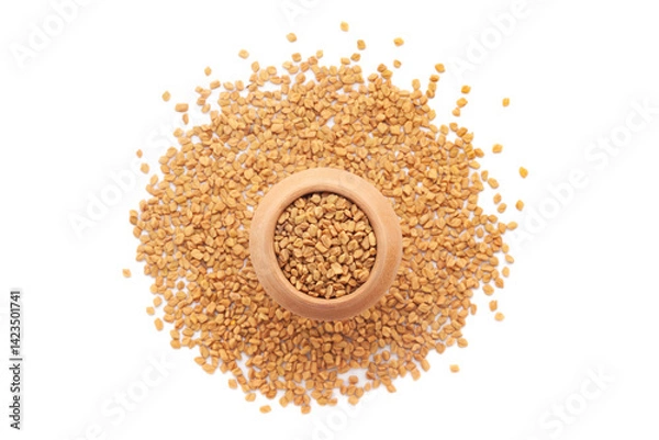 Obraz A mud pot filled with organic Fenugreek seeds (Trigonella foenum-graecum) is placed on a heap of fenugreek seeds, isolated on a white background.