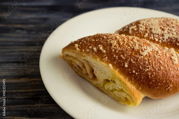 Fototapeta Austrian strudel with lemon and orange jam on a wooden table in rustic style