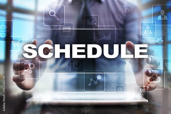 Fototapeta Businessman using tablet pc and selecting schedule.