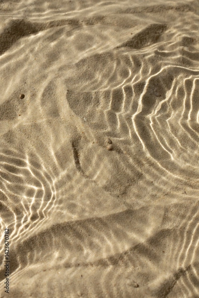 Obraz Water texture with shadows on sea beach sand