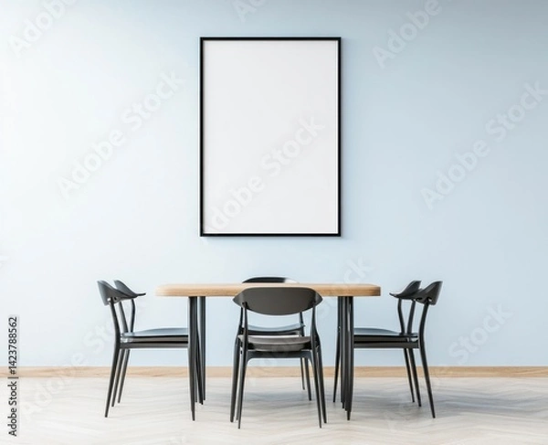 Fototapeta A dining room table with chairs and an empty picture frame
