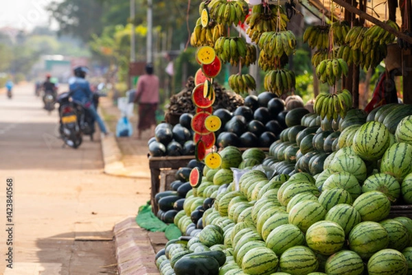 Obraz A street stall selling fruits and vegetables, mainly watermelons and bananas of different kinds in Pakse, Laos