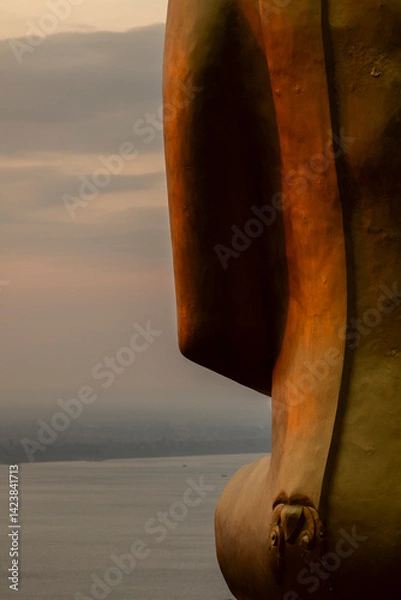 Obraz Close-up of a huge golden statue of Buddha, seated in a meditative position, at Wat Phousalao Temple, near Pakse, Champasak, Laos