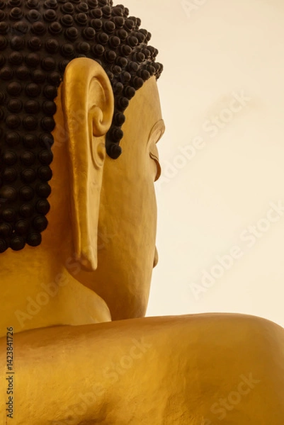 Obraz Close-up of a huge golden statue of Buddha, at Wat Phousalao Temple, near Pakse, Champasak, Laos