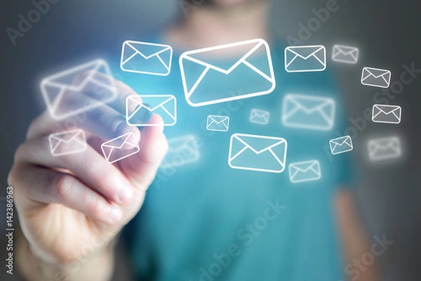 Fototapeta Concept of man drawing email icon on technology interface
