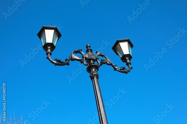 Obraz Ancient lantern on blue sky background