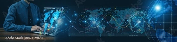 Fototapeta Using his computer, the businessman efficiently coordinates shipment schedules and export logistics to meet customer expectations.