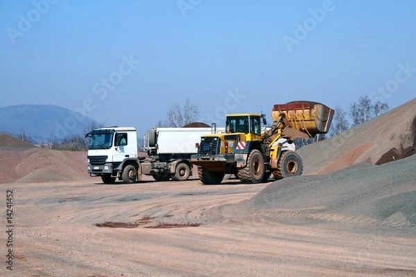 Obraz Heavy bulldozer loading ballast on the lorry