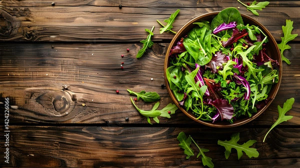 Fototapeta arugula salad close up on wooden background with space for text, diet banner with copy space
