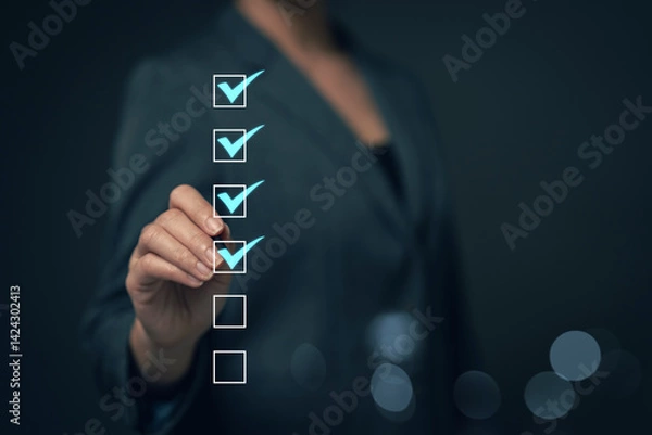 Obraz Reviewing and completing online survey forms document management system Assessment form, questionnaire, checklist and clipboard management Quality control...