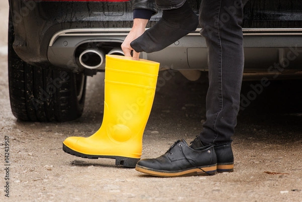 Obraz Worker with yellow boots