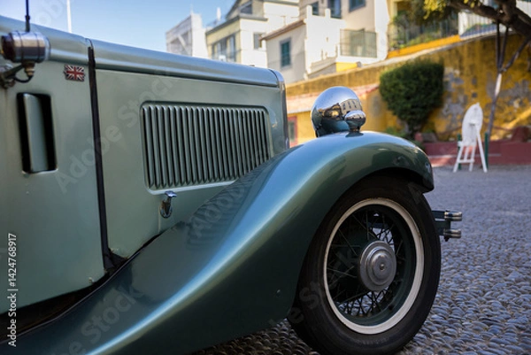Obraz Close up to vintage car front side in the street of Funchal, Madeira island, Portugal.
