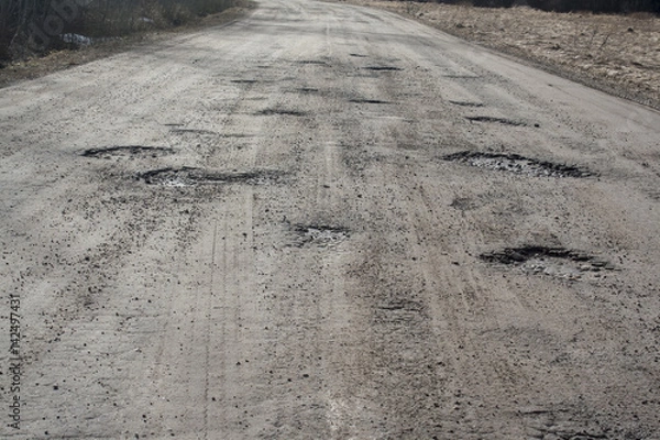 Obraz holes in asphalt road