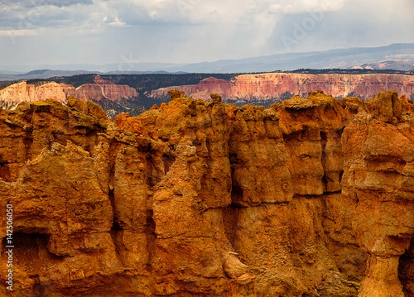 Fototapeta Bryce Canyon National Park, a sprawling reserve in southern Utah, is known for crimson-colored hoodoos, which are spire-shaped rock formations.