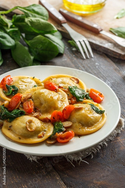 Fototapeta Process of cooking ravioli with spinach
