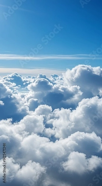 Fototapeta Serene Cloudscape: An Aerial View of Puffy Cumulus Clouds Under a Vivid Blue Sky