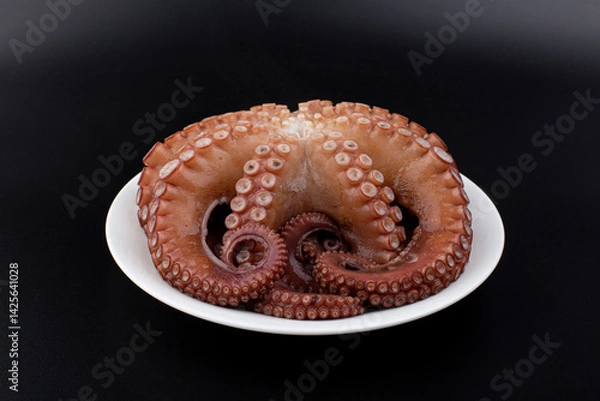 Obraz boiled octopus on a plate.