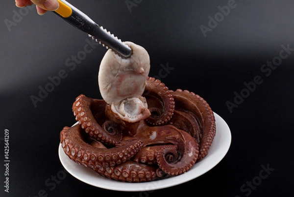 Obraz boiled octopus on a plate.