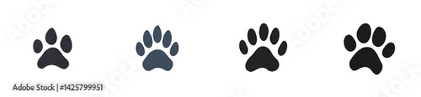 Fototapeta Animal tracks in a range of colors on a black background, cut out transparent