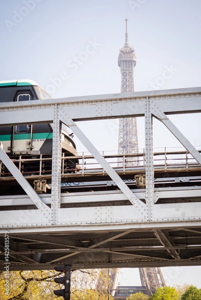 Fototapeta Dreamy spring Eiffel Tower from the metro bridge Bir Hakeim - Paris