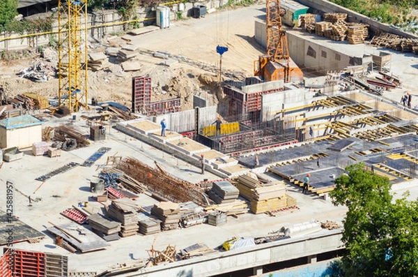 Fototapeta Aerial view of construction site, construction of new building in residential area