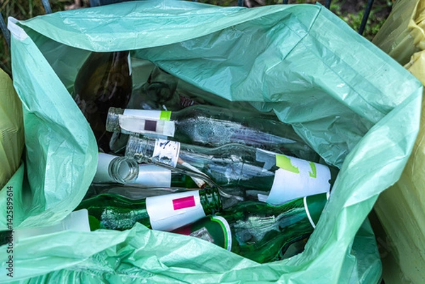 Fototapeta garbage, empty glass bottles in a garbage bag
