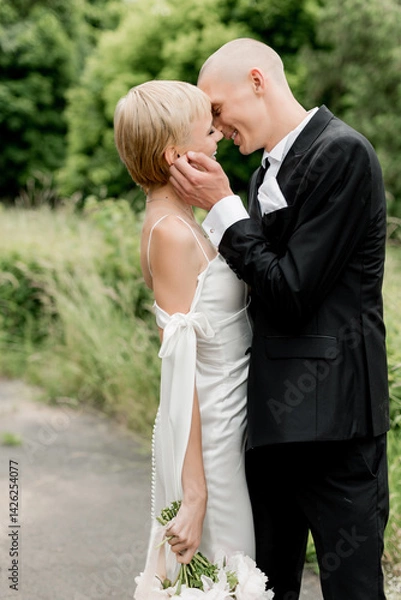Fototapeta Young attractive couple hugging in nature