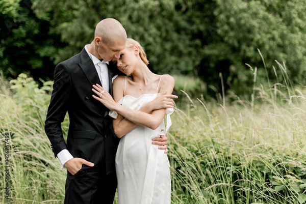 Obraz Young attractive couple hugging in nature