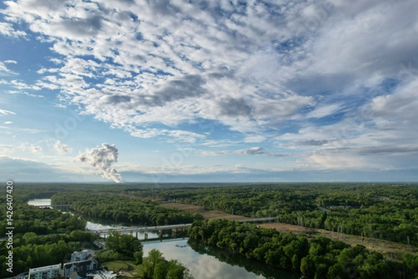 Fototapeta Dramatic clouds croos the sky over the Catawba River in Rock Hill, SC