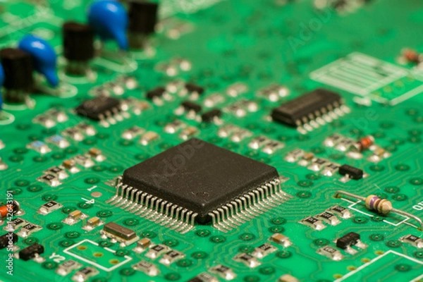 Fototapeta smd printed electronic circuit board with micro controller and components, shallow dof