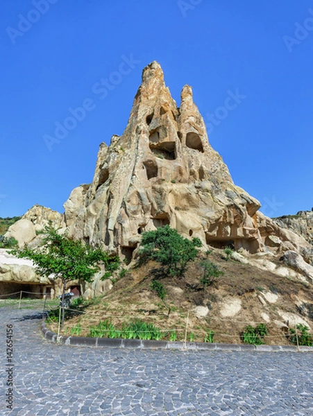 Fototapeta A geological formation consisting of volcanic tuff with cave dwelling. Cave monastery in Goreme Open Air Museum. Cappadocia in Central Anatolia is a UNESCO World Heritage Site since 1985, Turkey