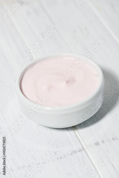 Obraz fruit yogurt in a white bowl, vertical